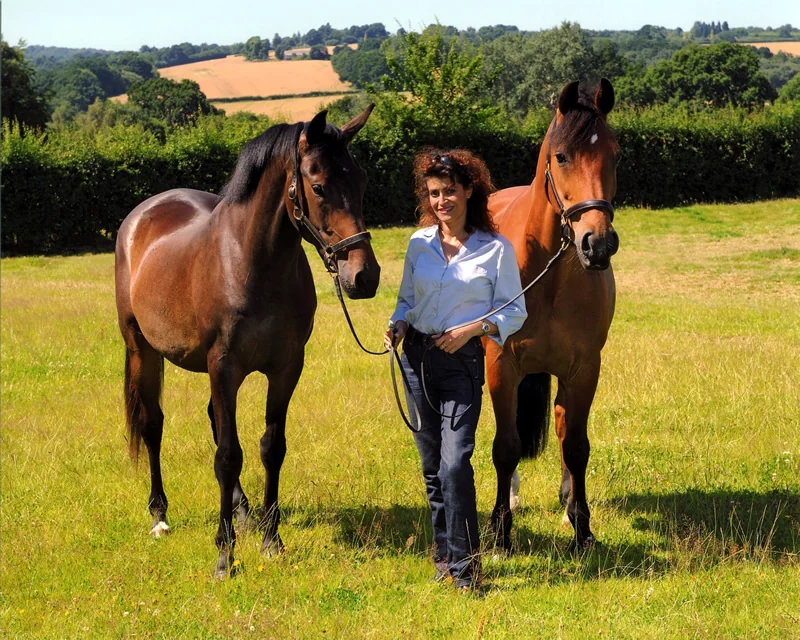 Carol with two horses in the fields at Ardenvale